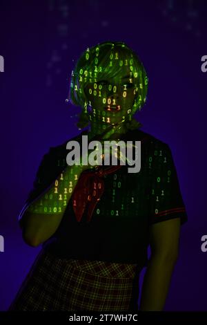 Computer Programming Cosplay woman in students uniform in neon programming symbols projection on ...