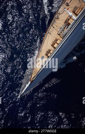 Aerial helicopter photo of the foredeck of the sailing yacht METEOR under full sail. Stock Photo