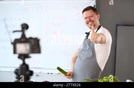 Cheerful Blogger Chef Showing Thumbup Gesture Joke Stock Photo