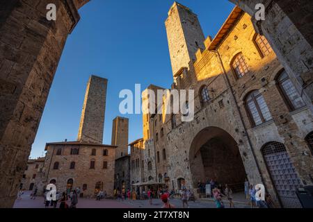 View of historic centre and towers in Piazza del Duomo, San Gimignano, UNESCO World Heritage Site, Province of Siena, Tuscany, Italy, Europe Stock Photo