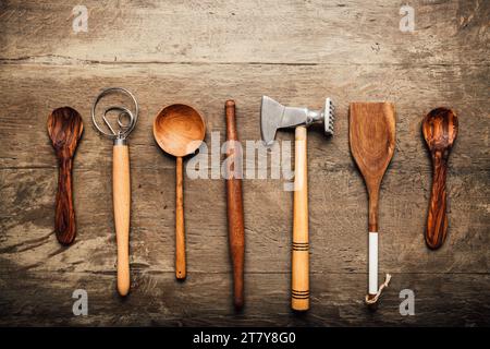 Vintage kitchen utensils (cooking tools) on wooden background Stock Photo
