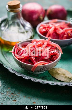 Homemade pickled sliced red onions with ingredients Stock Photo