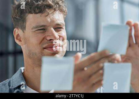 young office man at workplace making notes Stock Photo