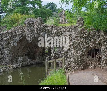 The man made Crystal Grotto beside the Serpentine Lake at Painshill Park, Cobham, Surrey, England, UK. Stock Photo