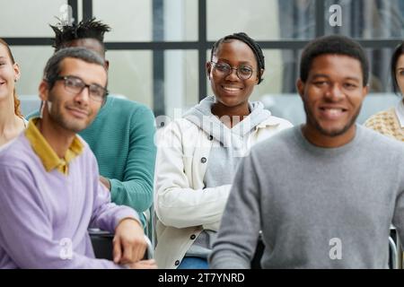 Happy multiethnic employees having fun while discussing project Stock Photo