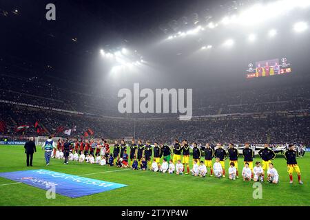 Teams of AC Milan and FC Barcelona line up just in front a banner against racism before the UEFA Champions league 2013/2014 football match group H between AC Milan and FC Barcelona on October 22, 2013 in Milan, Italy. Photo Massimo Cebrelli / DPPI Stock Photo