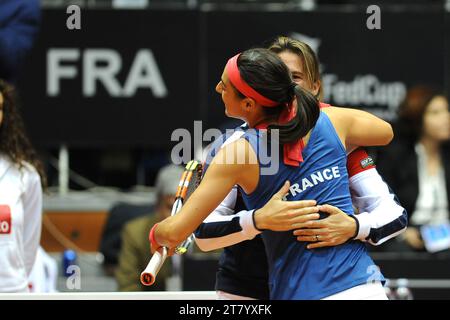 Caroline Garcia of France celebrates the victory against Camila Giorgi of Italy hugging coach Amelie Mauresmo during the first round of Fed Cup 2015 match between Italy and France at 105 Stadium on January 08, 2015 in Genoa, Italy. Photo Massimo Cebrelli/DPPI Stock Photo