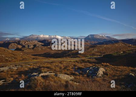Snowy Mountains from the A838 North of Scourie, Sutherland, North West Scotland, UK Stock Photo