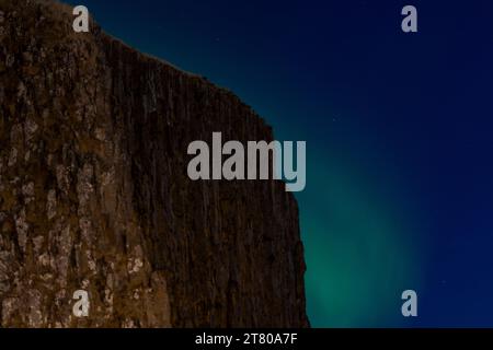 Aurora borealis Northern lightsn at Harbour wall in Sugandisey island Stykkishólmur Snaefellsnes Peninsula Iceland Stock Photo