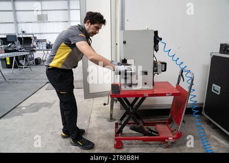 Pirelli’s engineers scrape down the tyres, marking each one by driver number and location of the tyre (front, rear, left or right) and collect data about the wear of the tyre that they then share with that team and the FIA, Mexican City Grand Prix, Mexico, 28 October 2023.  Each team is allocated one Pirelli engineer who can make suggestions based on the wear of the tyres.  Pirelli had one female track engineer at the Mexico City race, Mrs Monica Cuadrado, allocated to the Alpha Tauri team.    After the race in Qatar, the team noticed significant wear on one of the wheels, caused by pyramid cu Stock Photo