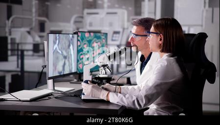Medical Research Scientist Conducting Blood Sample Test in Lab Stock Photo