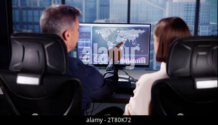 Financial Performance Analytics on Computer Dashboard with People Stock Photo