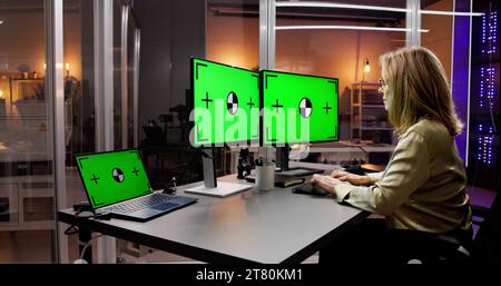 Productive Woman at Office Desk, Using Computer Screen Stock Photo