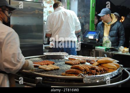 New York City, New York / USA - November 24 2022: German bratwurst at the Holiday Shops, Bank of America Winter Village at Bryant Park. Stock Photo