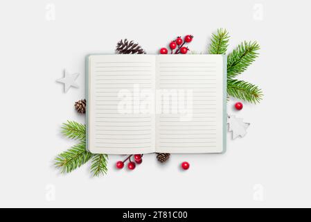 Empty notebook with text space. Festive Christmas decorations in the background. Copy space for holiday greetings or messages Stock Photo