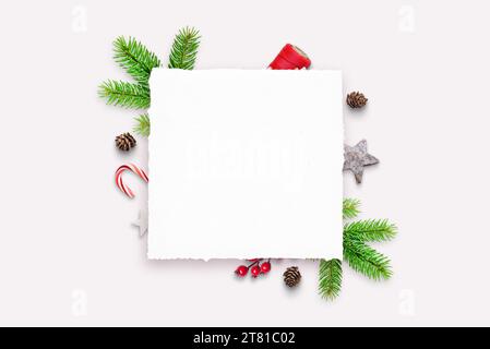 Empty paper sheet with copy space. Festive Christmas decorations in the background. Ideal for holiday messages and festive designs Stock Photo