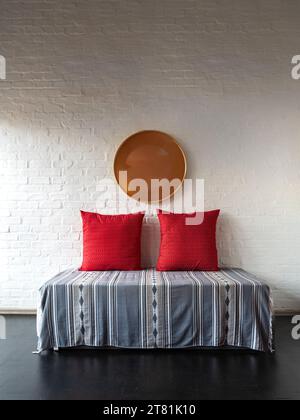 Concept of a furniture arrangement consisting of 3 geometrical shapes, photographed in an industrial style loft. Stock Photo