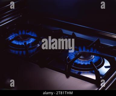 Kitchen gas stove with lit burners.  copy space. Stock Photo