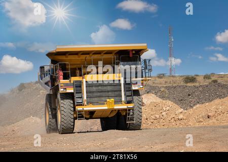 mining truck speeding on a dirt road at a diamond mine Stock Photo