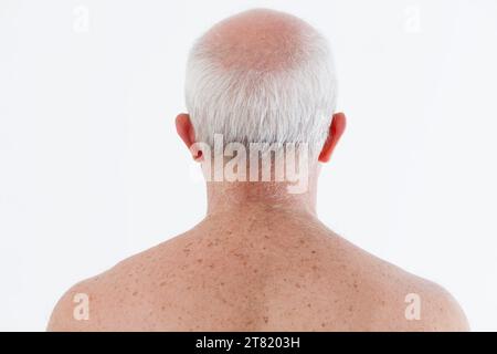 Back view of a senior man, showcasing natural aging and time's effects Stock Photo