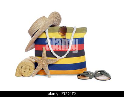 Stylish bag, starfish and other beach accessories isolated on white Stock Photo
