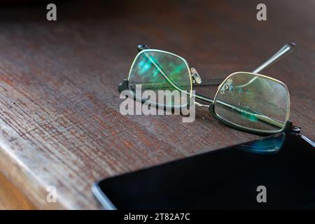 Artwork in retro style, Spectacles and book , vintage styled Stock Photo