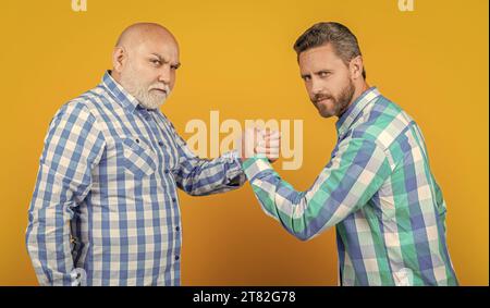 two contradiction of two generation in studio. contradiction of two generation on background. Stock Photo