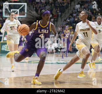 Hammond, USA. 17th Nov, 2023. LSU Lady Tigers guard Flau'jae Johnson (4) tries to drive past SE Louisiana Lady Lions guard Avari Berry (11) during a women's college basketball game at the University Center in Hammond, Louisiana on Friday, November 17, 2023. (Photo by Peter G. Forest/Sipa USA) Credit: Sipa USA/Alamy Live News Stock Photo