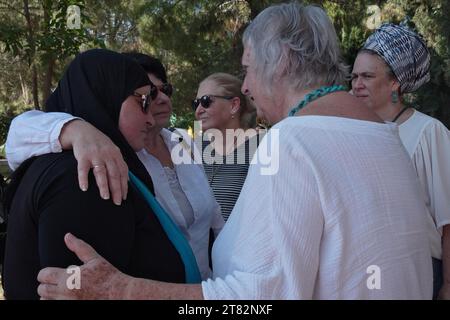 Arab-Israeli Ghadir Hani and Jewish women comfort each other, as friends and family mourn Vivian Silver, a Canadian-born Israeli activist who devoted her life to seeking peace with the Palestinians, who had been presumed kidnapped by Hamas, but recently declared dead after her remains were found at her home in Kibbutz Be'eri, during a memorial service on November 16, 2023 in Tel Gezer, Israel. Stock Photo
