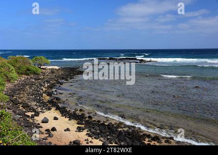 pretty beach and  coastline on a sunny day along the kauai path, north of kapa'a, kauai, hawaii Stock Photo