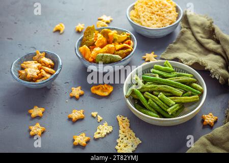 Bowls of healthy colorful vegetable and parmesan cheese chips Stock Photo