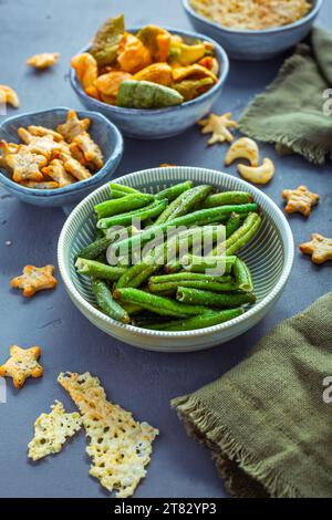 Bowls of healthy colorful vegetable and parmesan cheese chips Stock Photo