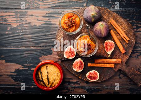 Homemade fig jam or jelly in a jar with cinnamon, vanilla and brown sugar Stock Photo