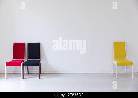yellow red black chair on a white background interior in a bright room Stock Photo
