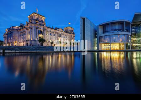 The Reichstag and the Paul-Loebe-Haus at the river Spree in Berlin during blue hour Stock Photo