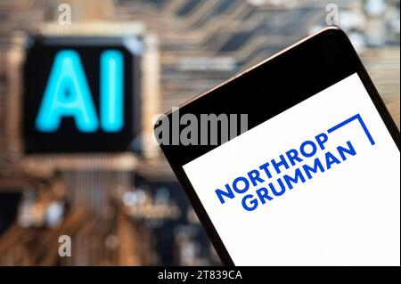 In this photo illustration, the American multinational aerospace and defense technology company Northrop Grumman (NYSE: NOC) logo seen displayed on a smartphone with an Artificial intelligence (AI) chip and symbol in the background. (Photo by Budrul Chukrut / SOPA Images/Sipa USA) *** Strictly for editorial news purposes only *** Stock Photo