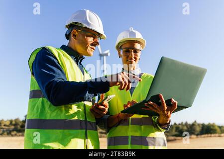 Engineers working on a sustainable energy project. Stock Photo