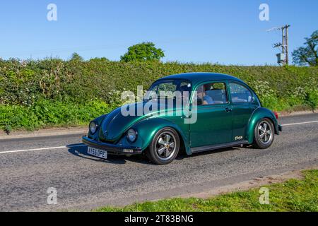 2005 Metallic custom personalised Green Vw Volkswagen Beetle; Vintage, restored British classic motors, automobile collectors,  motoring enthusiasts and historic veteran cars travelling in Cheshire, UK Stock Photo