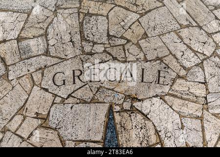 View from above of a compass rose with the indication of the Gregale, a Mediterranean wind, on a mosaic floor, Finale Ligure, Savona, Liguria, Italy Stock Photo