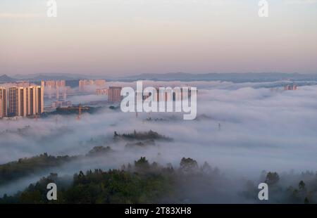 Beijing, China. 17th Nov, 2023. This aerial photo taken on Nov. 17, 2023 shows the scenery of advection fog in Guang'an, southwest China's Sichuan Province. Credit: Zhou Xiujian/Xinhua/Alamy Live News Stock Photo