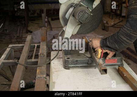 Large saw for cutting metal. Tool in metal workshop. Steel processing. Stock Photo