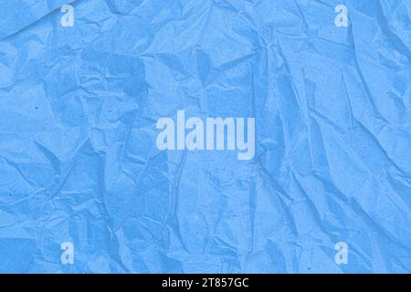 Sheet of crumpled light blue paper as background, top view Stock Photo