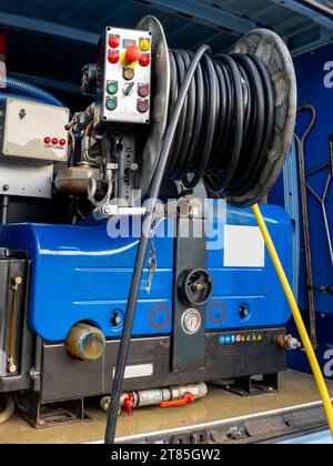 Sewer cleaning equipment service vehicle. Equipment for hydraulic flushing of urban sewerage. control panel, hoses, pumps, pressure gauges Stock Photo
