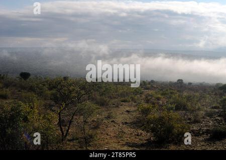 As the world battles climate change mist covers Maja village on the edges of the Drakensberg mountains in Limpopo, South Africa as weather patterns Stock Photo