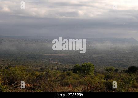 As the world battles climate change mist covers Maja village on the edges of the Drakensberg mountains in Limpopo, South Africa as weather patterns Stock Photo