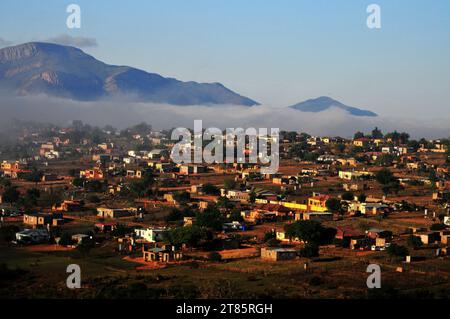 As the world battles climate change mist covers Maja village on the edges of the Drakensberg mountains in Limpopo, South Africa as weather patterns Stock Photo