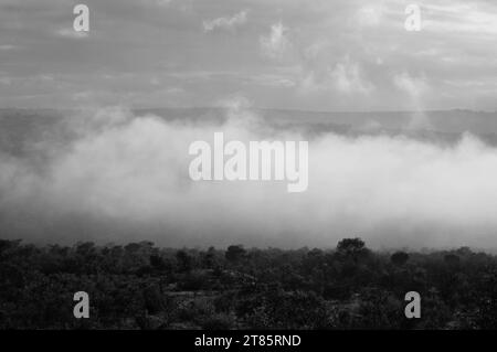 As the world battles climate change mist covers Maja village on the edges of the Drakensberg mountains in Limpopo, South Africa as weather patterns Stock Photo