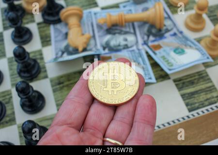 a bitcoin is in the palm of my hand, it is a risky investment Stock Photo