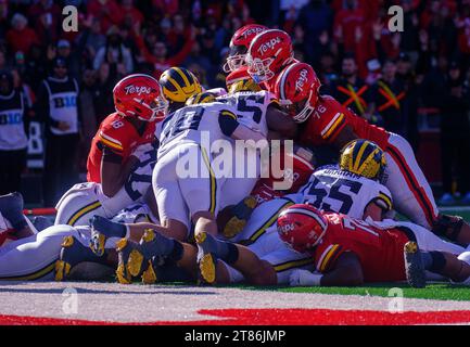 College Park, USA. 18th Nov, 2023. COLLEGE PARK, MD - NOVEMBER 18: Maryland pile on for a touchdown during a Big Ten football game between the Maryland Terrapins and the Michigan Wolverines, on November 18, 2023, at SECU Field, in College Park, Maryland. (Photo by Tony Quinn/SipaUSA) Credit: Sipa USA/Alamy Live News Stock Photo