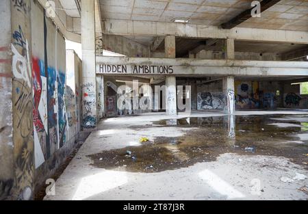 Graffiti painted along the former Sniper Tower in western Mostar, Bosnia and Herzegovina Stock Photo